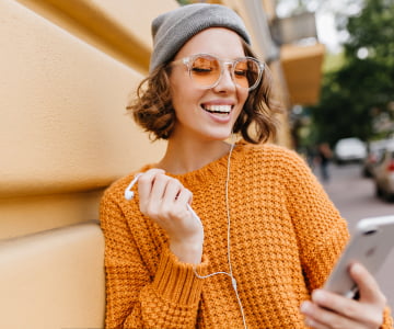 a woman listening to music using her phone 