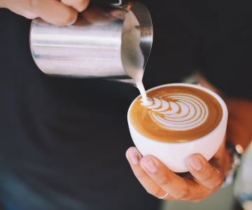 Pouring milk into the blended coffee